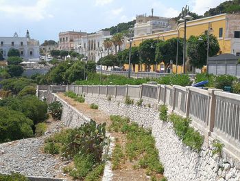 View of canal amidst buildings in city