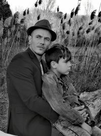 Portrait of mother and son on land