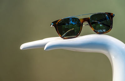 Close-up of sunglasses on mannequin hand