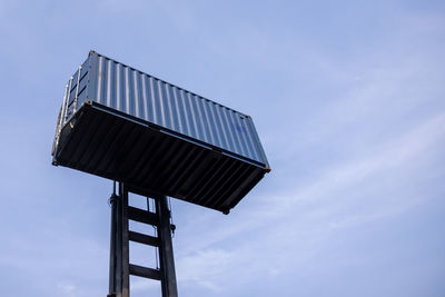 Forklift handling container box and blue sky background