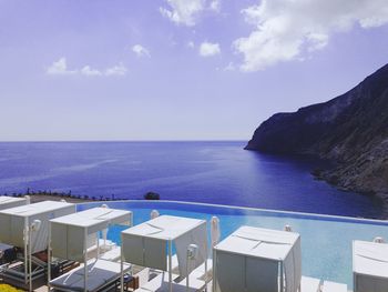 High angle view of swimming pool by sea against sky