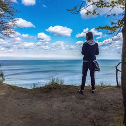 Scenic view of sea against cloudy sky