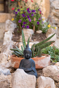 Close-up of statue on rock