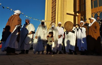 Group of people in front of city