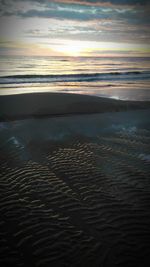 View of calm sea at sunset