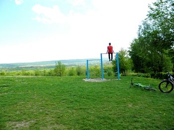 Full length of girl standing on grassy field