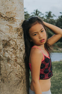 Portrait of a teenage girl standing outdoors