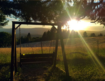 Scenic view of field against sky during sunset