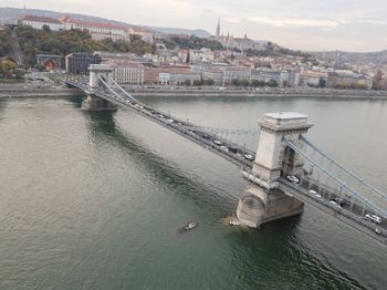High angle view of bridge over river by buildings in city
