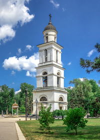 View of building and trees against sky