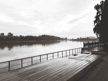 Pier over lake against sky