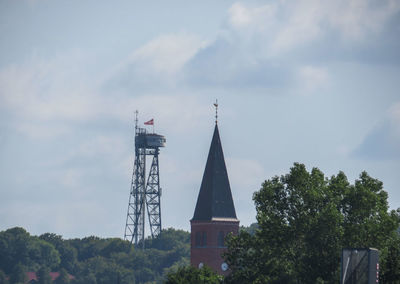 Low angle view of building against cloudy sky