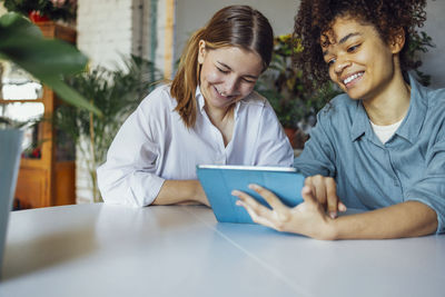 Business colleagues working at table