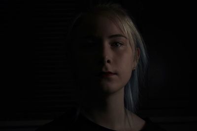 Close-up portrait of a serious young woman