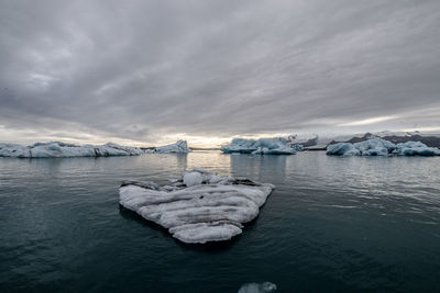 Scenic view of frozen lake against sky