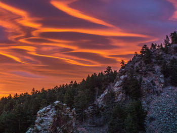 Scenic view of mountains against sky at sunset