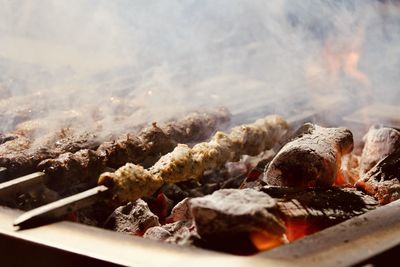 Close-up of meat on barbecue grill