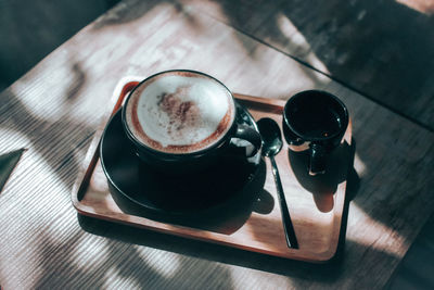 High angle view of coffee cup on table