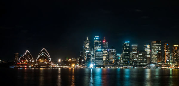 Illuminated city buildings at night