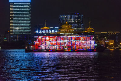 Illuminated buildings in city at night