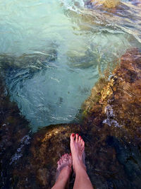 Low section of woman in water