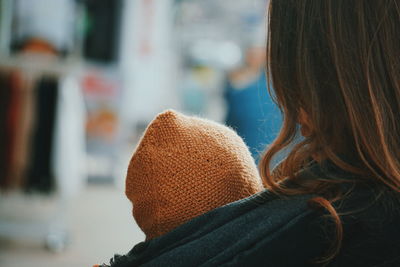 Rear view of woman in hat