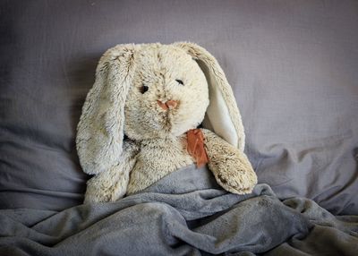 Close-up of stuffed toy on bed