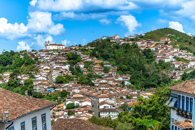 Buildings in town against sky