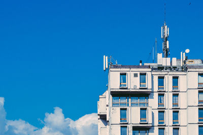 Low angle view of building against clear blue sky