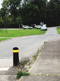 Empty road by street in city