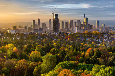 View of cityscape against cloudy sky