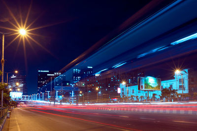 Illuminated light trails on road at night