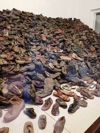 High angle view of stack of shoes on floor