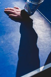 Cropped image of person hand on table