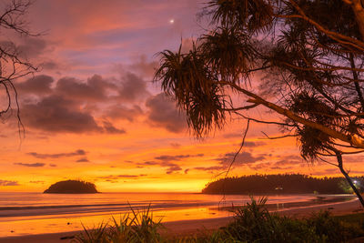 Scenic view of sea against romantic sky at sunset