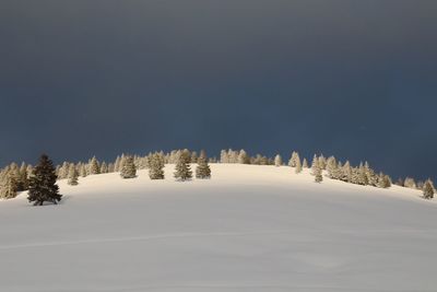 Scenic view of snow covered landscape against sky