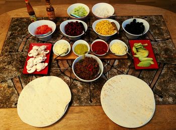 Directly above shot of served foods on table