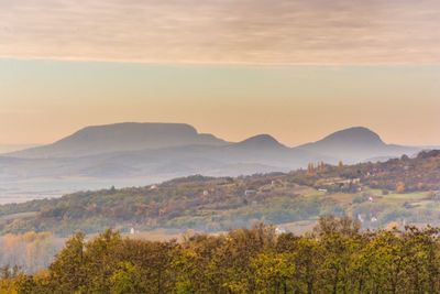 Scenic view of landscape and mountains against sky