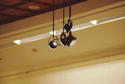 Illuminated pendant lights hanging from ceiling