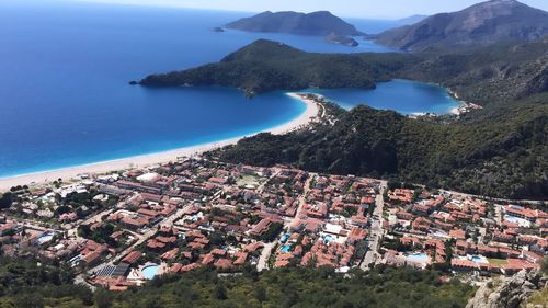 High angle view of townscape by sea