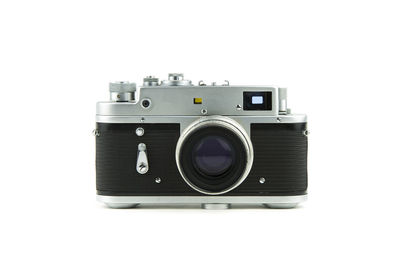 Close-up of vintage camera on white background