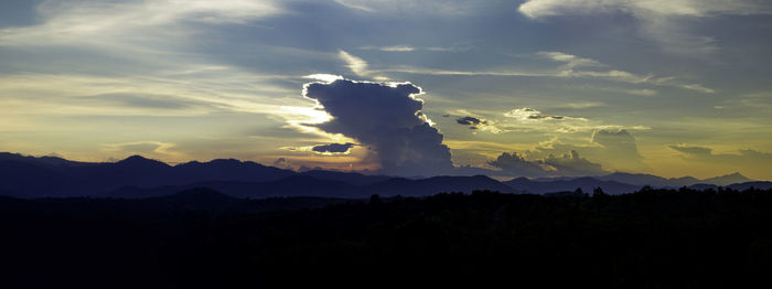 Scenic view of silhouette mountain against sky during sunset