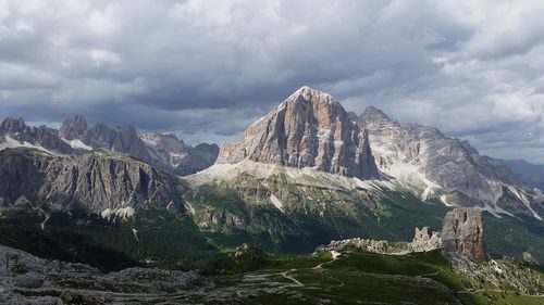 Scenic view of mountains against cloudy sky