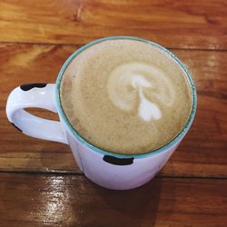 High angle view of cappuccino on table