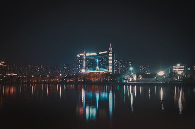 Reflection of buildings in city at night