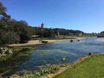 Scenic view of sea against clear blue sky