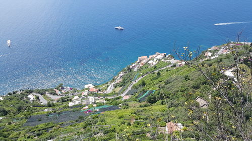 High angle view of townscape by sea