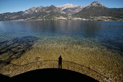 Scenic view of sea in front of mountains