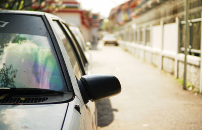 Close-up of car on side-view mirror