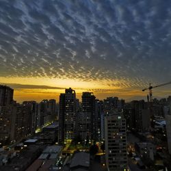 High angle view of buildings against sky during sunset